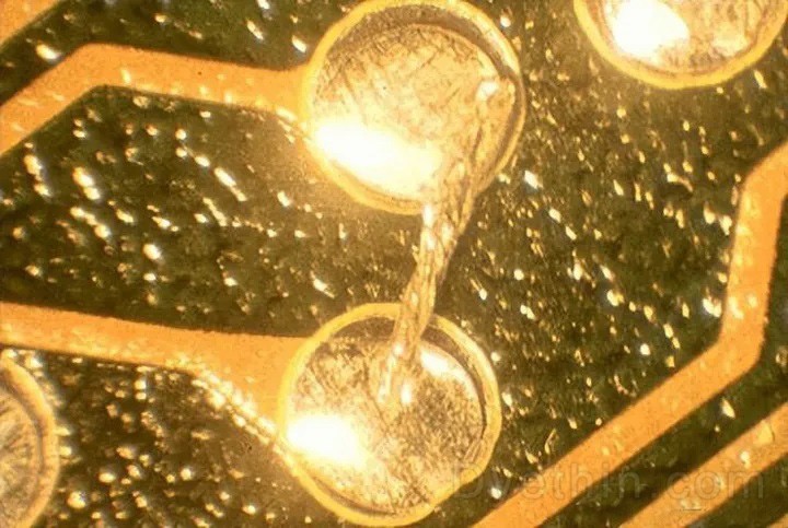 Another solder ball attached to the edge of the resist Another solder ball attached to the edge of the resist